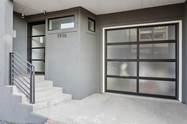 doorway to property featuring a garage