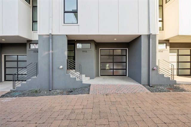 property entrance featuring stucco siding