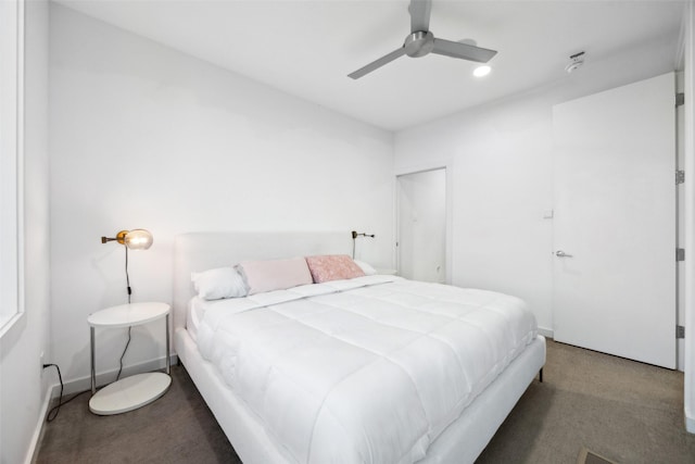 carpeted bedroom with a ceiling fan and baseboards