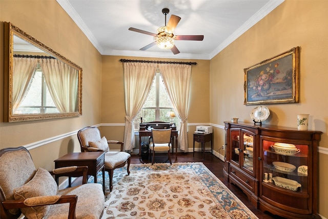 living area featuring ceiling fan, ornamental molding, and dark hardwood / wood-style floors