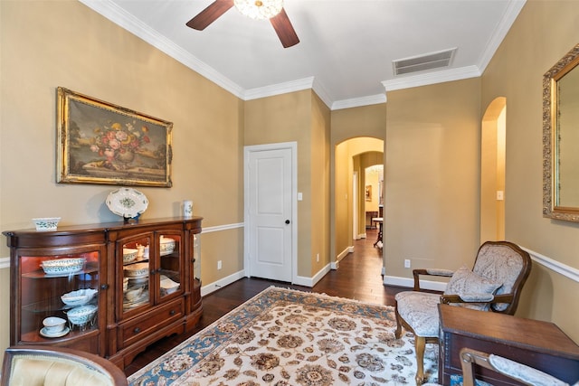 7514 Saddle Blanket Dr, Waller, TX 77484 - living area with arched walkways, dark wood-type flooring, a ceiling fan, ornamental molding, and baseboards