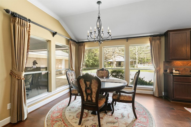 7514 Saddle Blanket Dr, Waller, TX 77484 - dining space featuring vaulted ceiling, a chandelier, dark wood-style floors, and ornamental molding