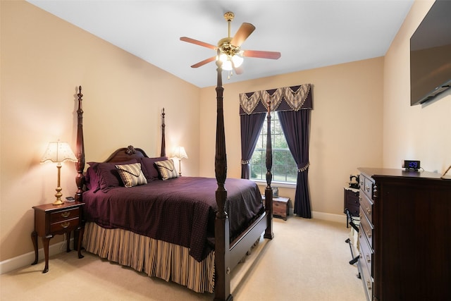 bedroom with light carpet and ceiling fan