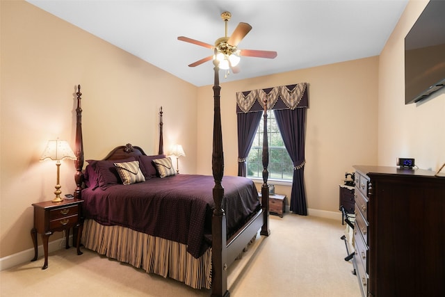7514 Saddle Blanket Dr, Waller, TX 77484 - bedroom with baseboards, light carpet, and a ceiling fan
