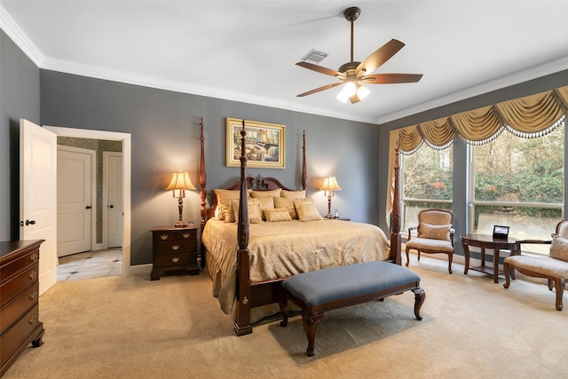 carpeted bedroom featuring ceiling fan and ornamental molding