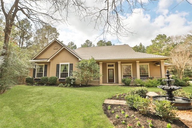 view of front of property featuring a porch and a front lawn