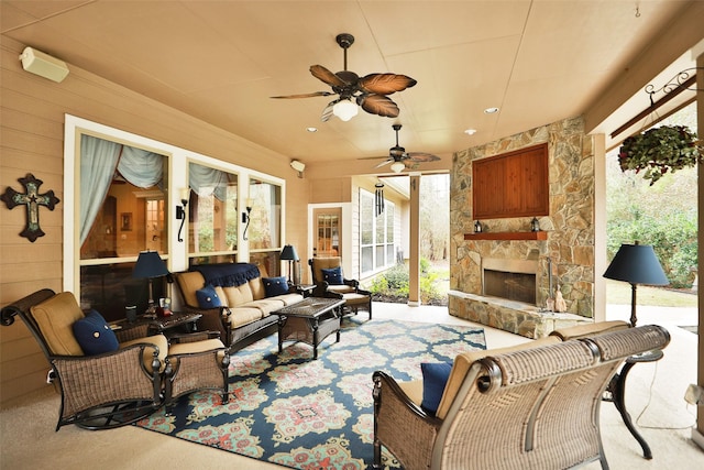 view of patio featuring an outdoor living space with a fireplace