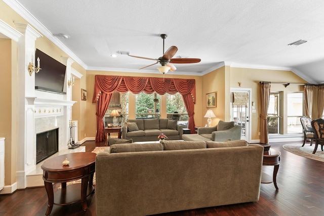 7514 Saddle Blanket Dr, Waller, TX 77484 - living room featuring baseboards, a ceiling fan, ornamental molding, a fireplace, and dark wood finished floors