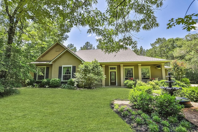 7514 Saddle Blanket Dr, Waller, TX 77484 - back of property featuring a lawn and a shingled roof
