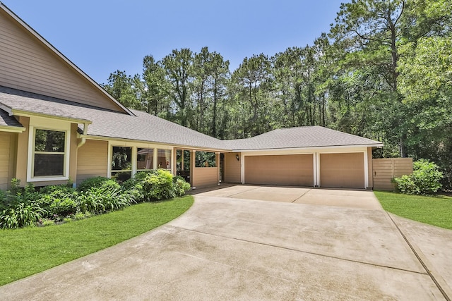 7514 Saddle Blanket Dr, Waller, TX 77484 - view of front facade featuring concrete driveway, an attached garage, and a shingled roof