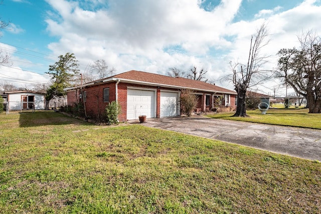 view of front of property with a garage and a front lawn