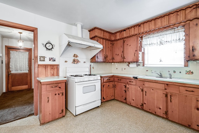 kitchen featuring white range with gas cooktop, sink, and decorative backsplash