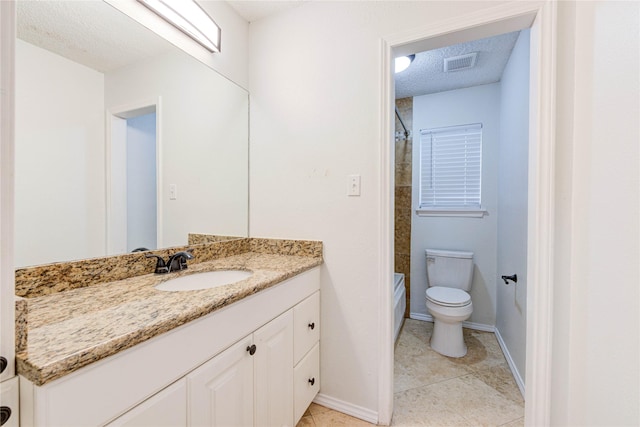 full bathroom with tile patterned floors, toilet, tub / shower combination, a textured ceiling, and vanity