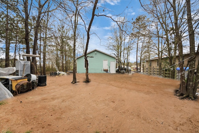 view of yard with dirt driveway