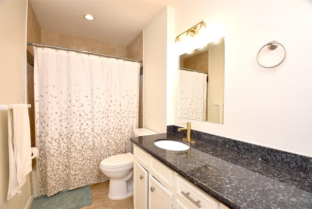 bathroom featuring curtained shower, vanity, toilet, tile patterned floors, and a textured ceiling