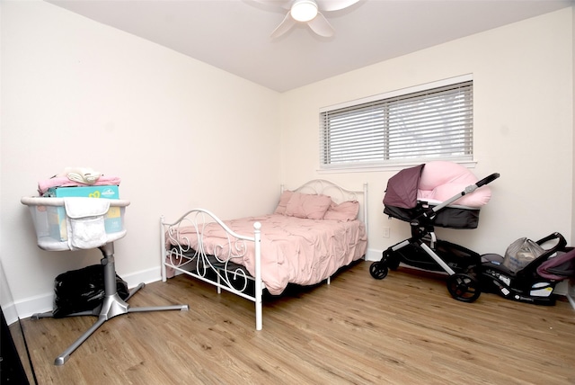 bedroom featuring hardwood / wood-style floors and ceiling fan