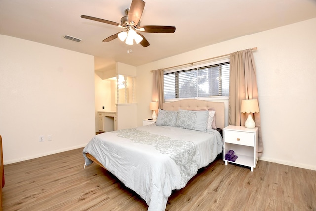 bedroom with light hardwood / wood-style floors and ceiling fan