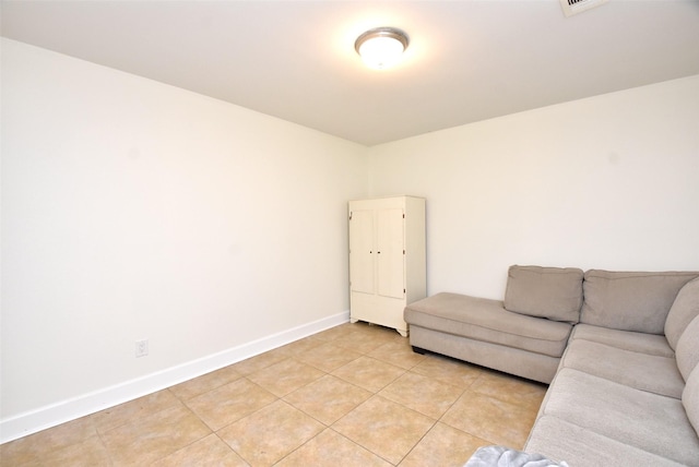 unfurnished living room with light tile patterned floors