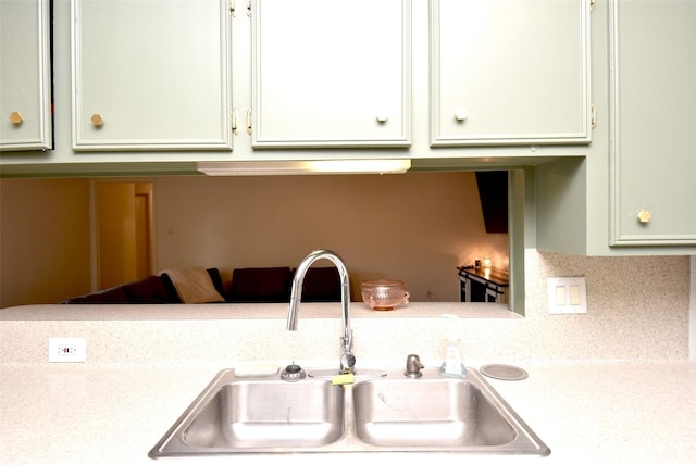 kitchen with sink and green cabinetry