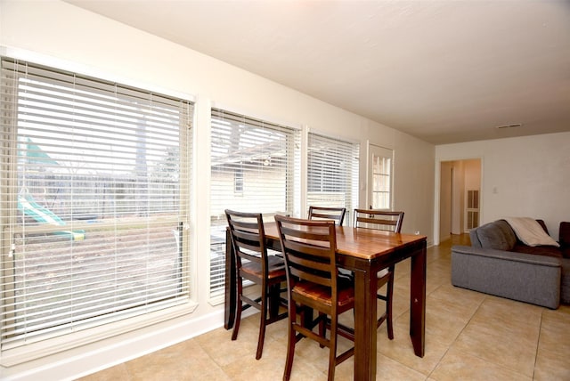 dining space with light tile patterned floors