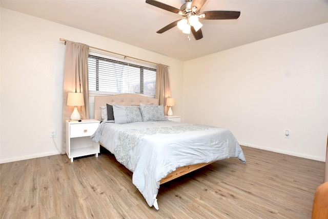 bedroom with ceiling fan and light wood-type flooring