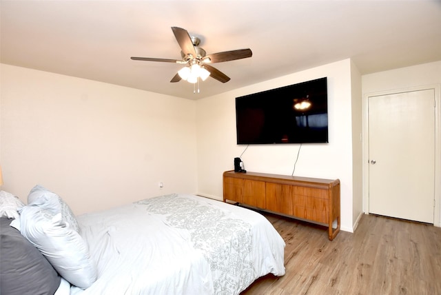 bedroom with ceiling fan and light wood-type flooring