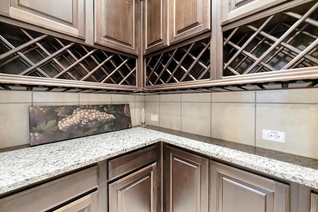 interior space featuring indoor bar and decorative backsplash