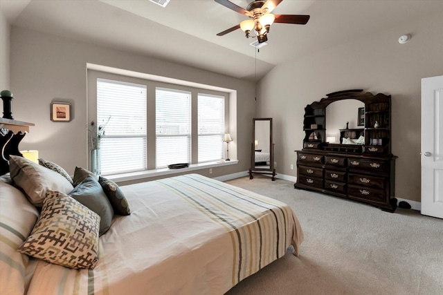 carpeted bedroom featuring vaulted ceiling and ceiling fan