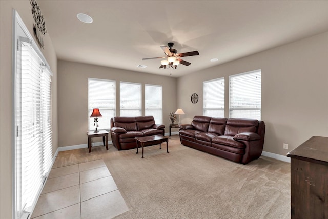 tiled living room featuring ceiling fan