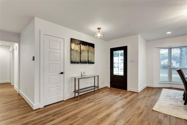 foyer with light hardwood / wood-style floors