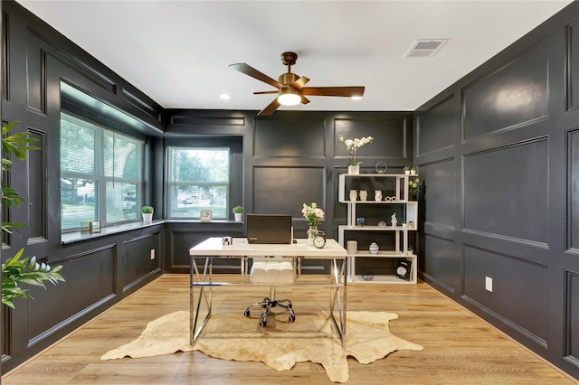 office space featuring ceiling fan and light hardwood / wood-style flooring