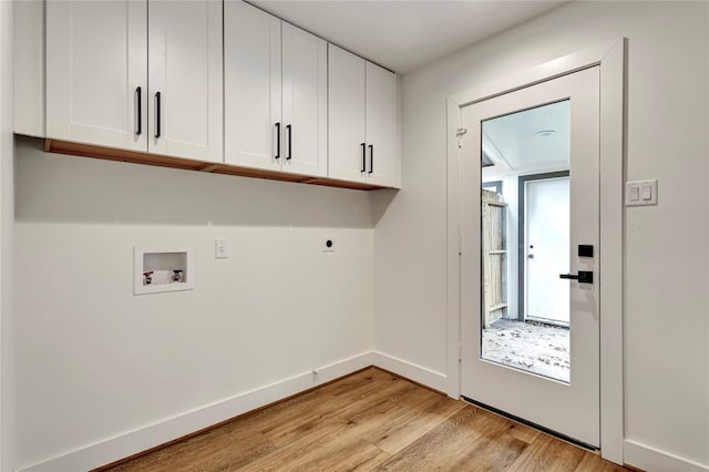 laundry area with cabinets, washer hookup, hookup for an electric dryer, and light wood-type flooring