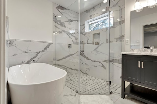 bathroom with tile walls, vanity, and plus walk in shower