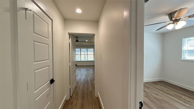 corridor featuring light hardwood / wood-style floors