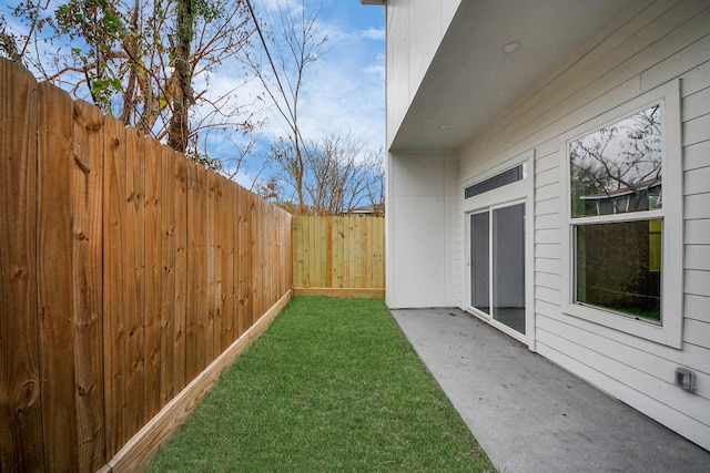 view of yard featuring a fenced backyard and a patio