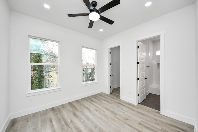 unfurnished bedroom with recessed lighting, light wood-style flooring, connected bathroom, ceiling fan, and baseboards