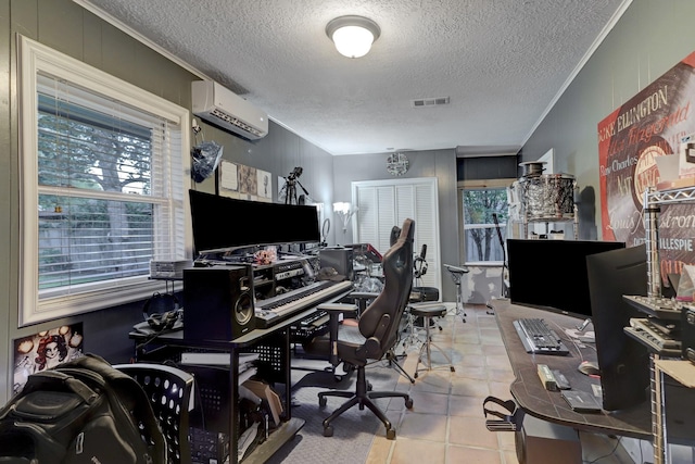 office area with crown molding, a healthy amount of sunlight, a wall mounted AC, and a textured ceiling