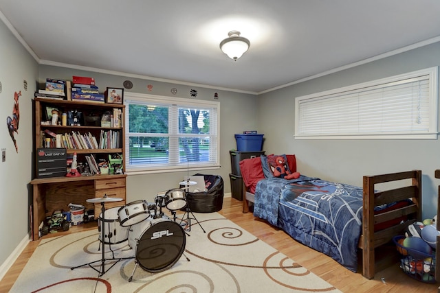 bedroom featuring crown molding and hardwood / wood-style floors