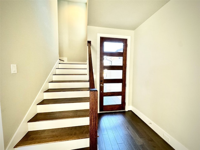 entryway with dark wood-type flooring