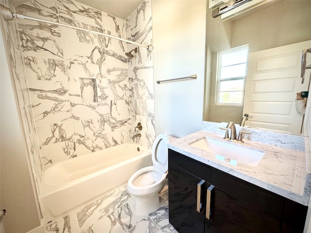 full bathroom with tiled shower / bath combo, vanity, and toilet