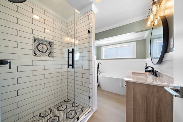 bathroom featuring vanity, crown molding, shower with separate bathtub, and hardwood / wood-style flooring