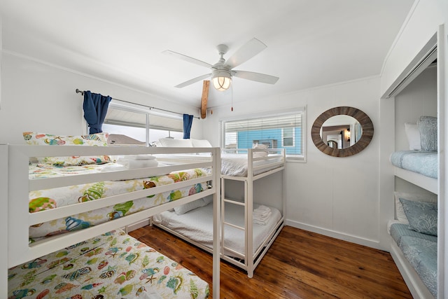 bedroom featuring dark wood-type flooring and ceiling fan