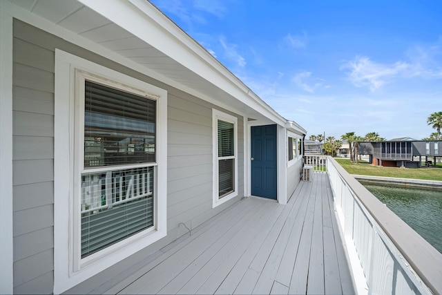 deck featuring a water view