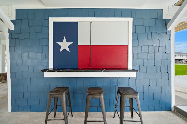 bar with concrete flooring