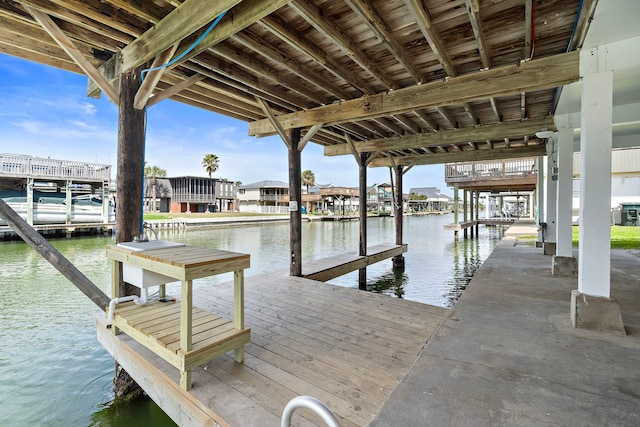 dock area with a water view