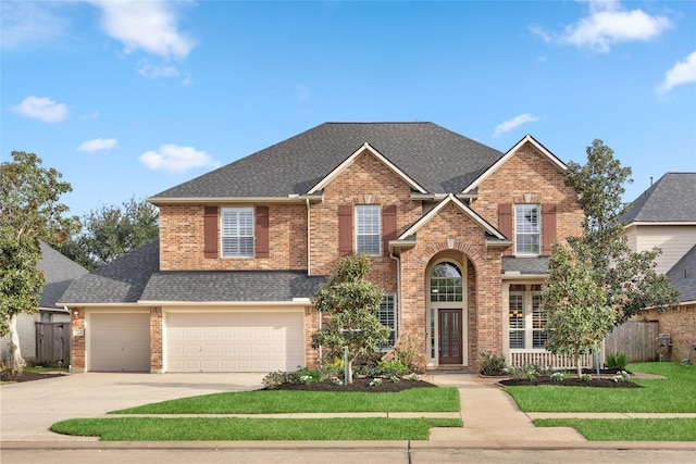 traditional-style house featuring brick siding and a shingled roof