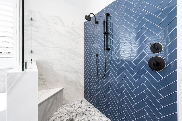 bathroom with tiled shower