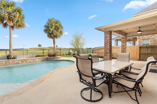 view of pool with a fenced in pool, a fenced backyard, ceiling fan, and a patio