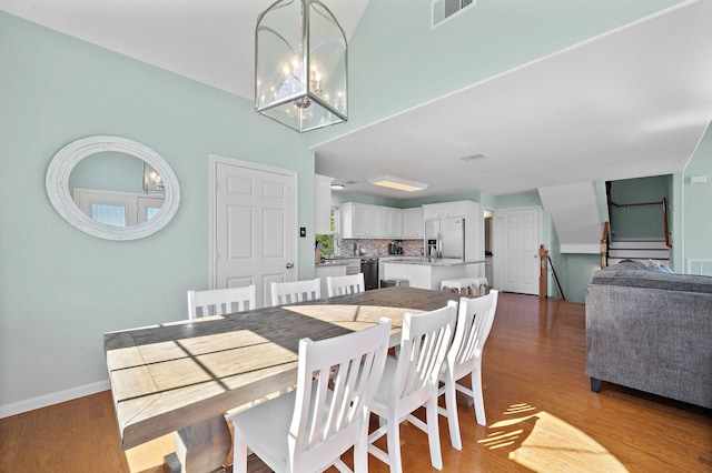 3418 Miramar Dr, Shoreacres, TX 77571 - dining space with a notable chandelier and light wood-type flooring