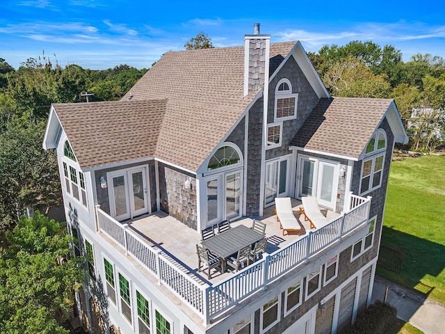 rear view of property featuring a patio